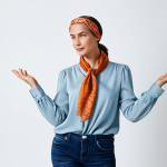 Scarf Styling**

"A woman with a stylish silk scarf tied as a headband, standing in a bright, airy studio, wearing a modest blouse and casual jeans, fully clothed, safe for work, appropriate content, family-friendly, perfect anatomy, natural pose, well-formed hands, proper finger count, high quality, professional fashion photography."

**